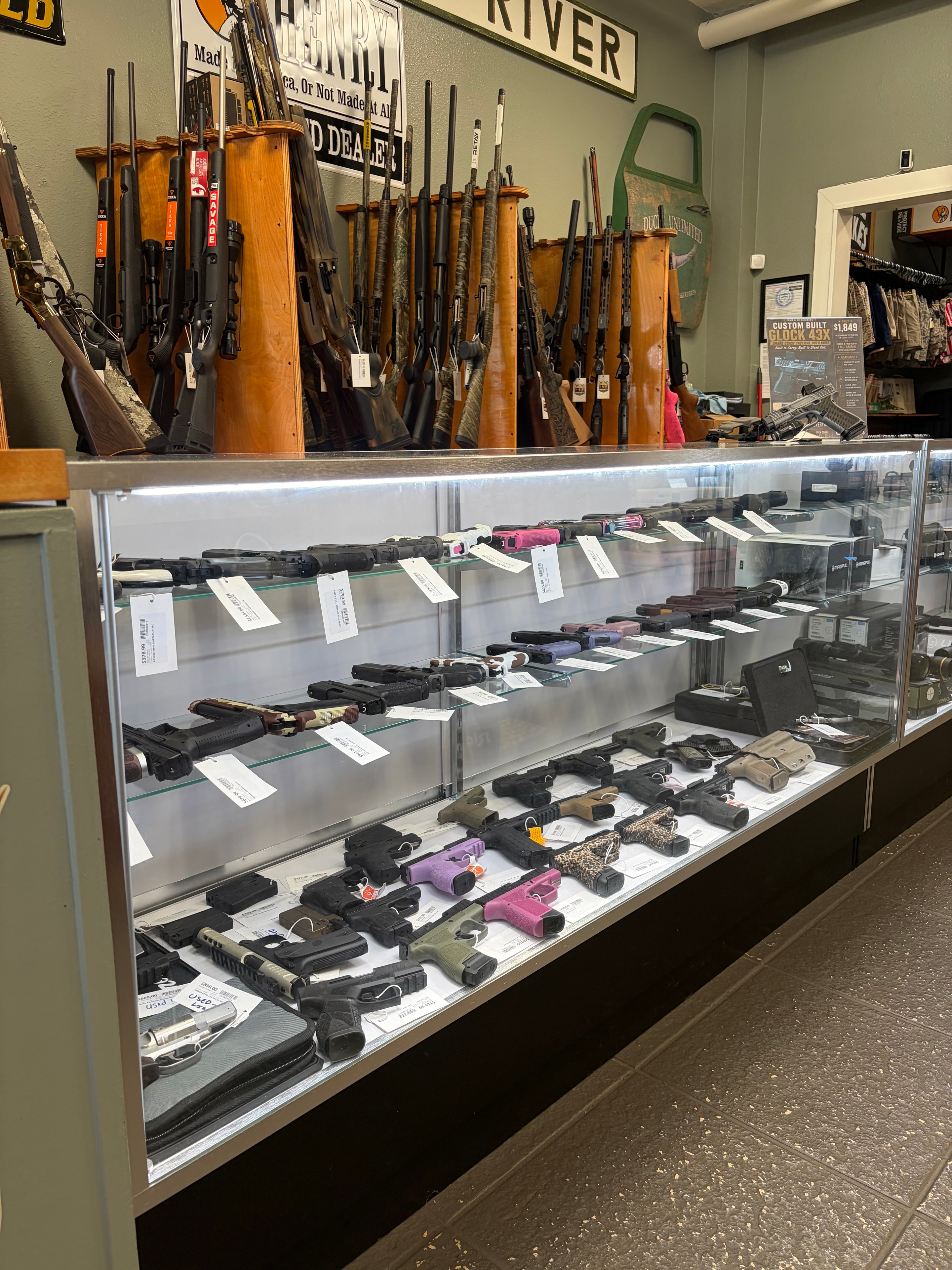 Handgun display case and long gun wall at Crum and Co. Outdoors in Apalachicola